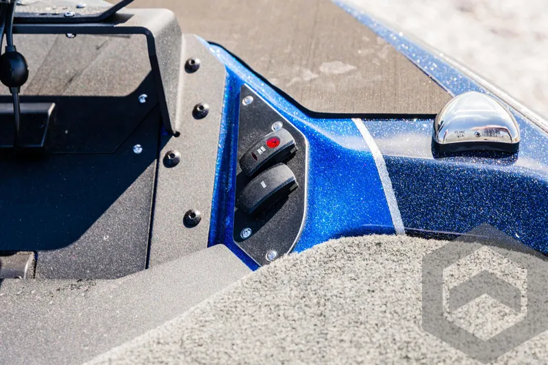Slide: The Image of Close-up of 2025 Skeeter ZXR 21 boat controls with blue metallic finish. - 36