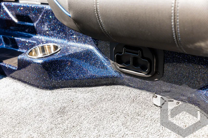 Slide: The Image of 2025 Skeeter ZXR 21 boat interior with cup holder and textured flooring. - 44