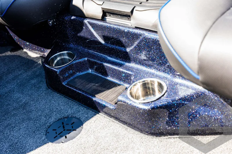 Slide: The Image of Interior of 2025 Skeeter ZXR 21 boat with cup holders and carpeted flooring. - 45