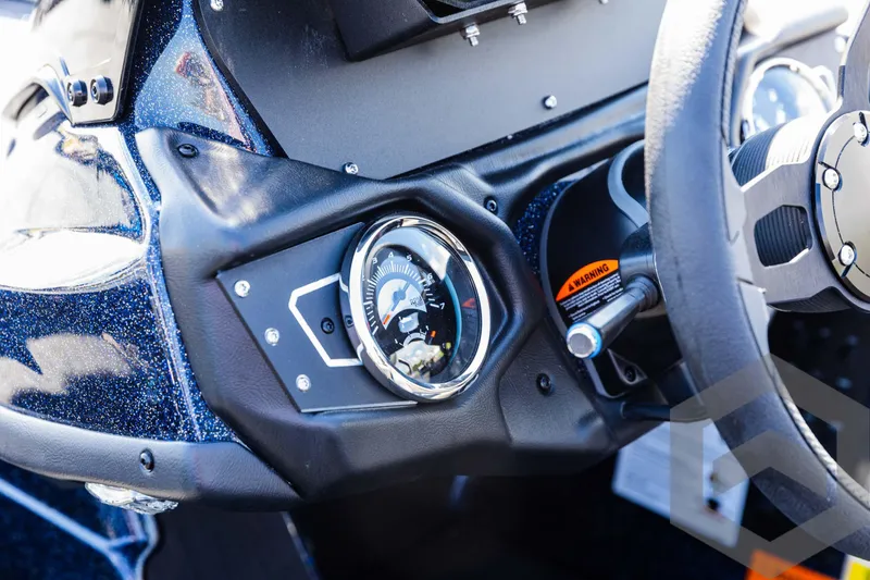 Slide: The Image of 2025 Skeeter ZXR 21 dashboard with steering wheel and instrument panel. - 49