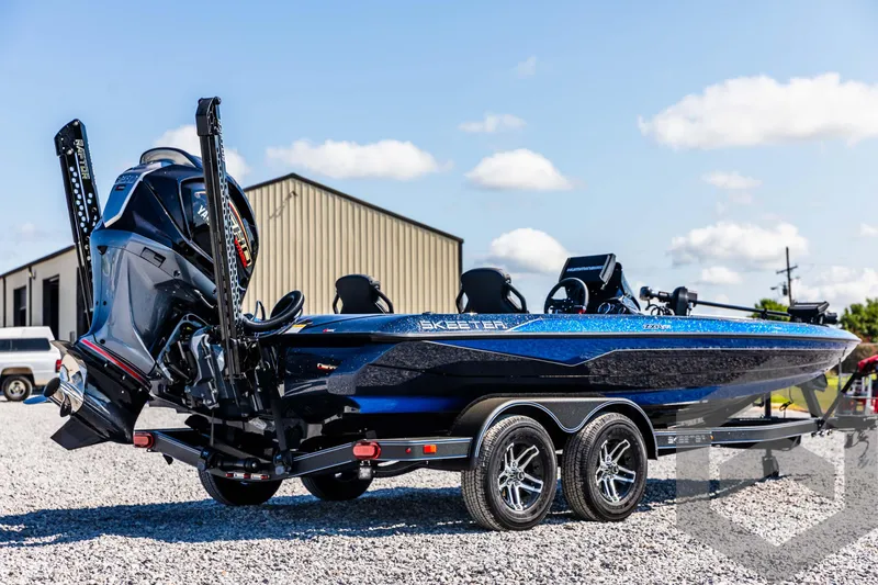 Slide: The Image of 2025 Skeeter ZXR 21 bass boat on trailer, parked outdoors. - 5