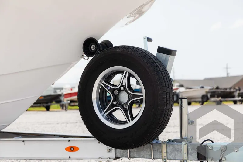 Slide: The Image of 2025 Tidewater 2300 Carolina Bay boat trailer with spare tire. - 10