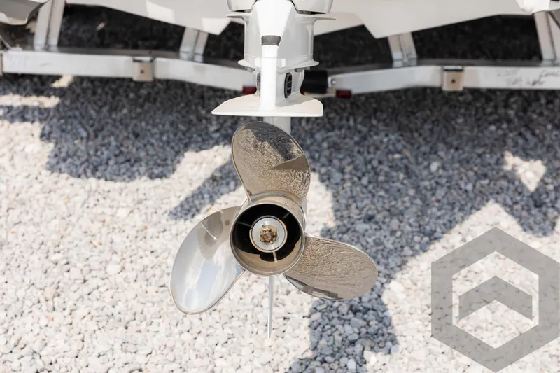 Slide: The Image of 2025 Tidewater 2300 Carolina Bay boat propeller on gravel surface. - 16
