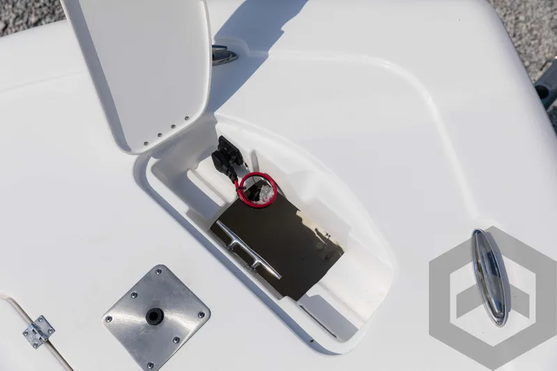 Slide: The Image of Tidewater 2300 Carolina Bay 2025 boat deck with storage compartment and hardware. - 25