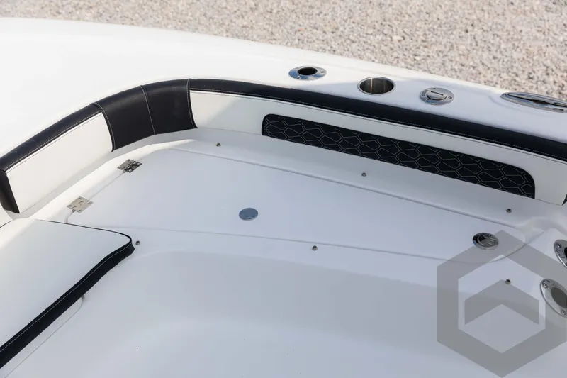 Slide: The Image of 2025 Tidewater 2300 Carolina Bay boat interior with sleek white and black design. - 36