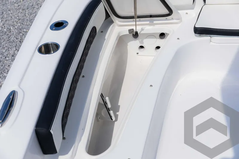 Slide: The Image of 2025 Tidewater 2300 Carolina Bay boat interior with storage compartment and seating. - 39