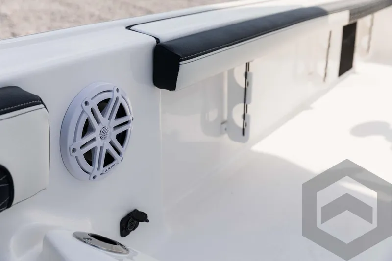 Slide: The Image of 2025 Tidewater 2300 Carolina Bay boat interior with speaker and seating detail. - 43