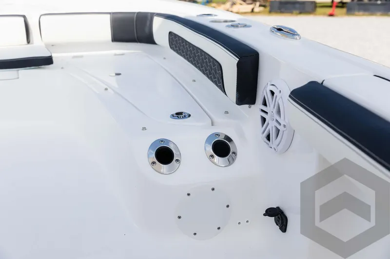 Slide: The Image of 2025 Tidewater 2300 Carolina Bay boat interior with sleek seating and modern speaker system. - 45