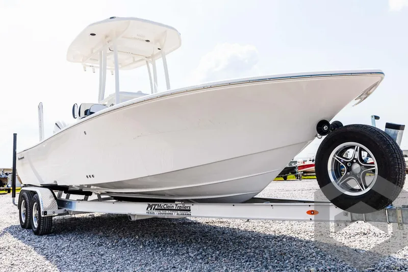 Slide: The Image of 2025 Tidewater 2300 Carolina Bay boat on trailer, side view. - 9