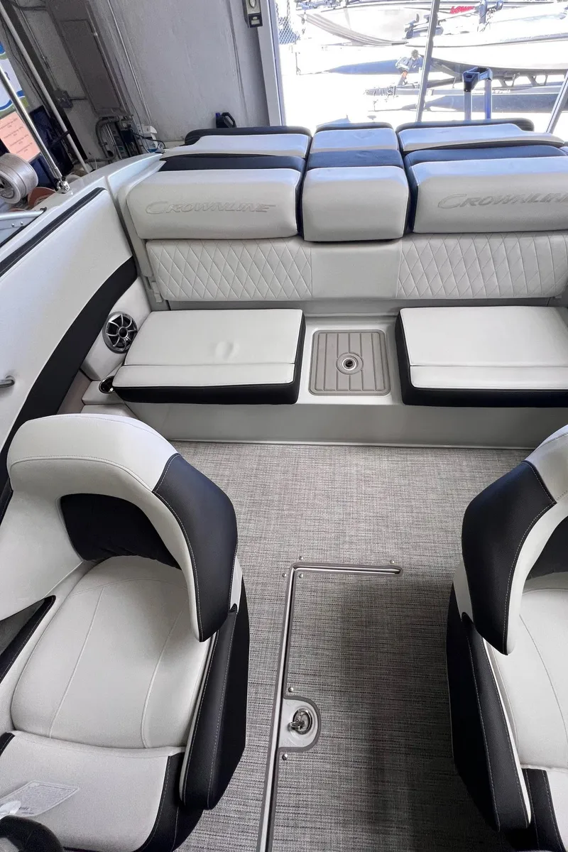 Slide: The Image of 2024 Crownline 210SS boat interior with sleek seating and modern design. - 10