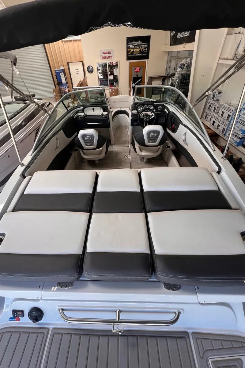 Slide: The Image of 2024 Crownline 210SS boat interior with spacious seating and modern dashboard. - 13