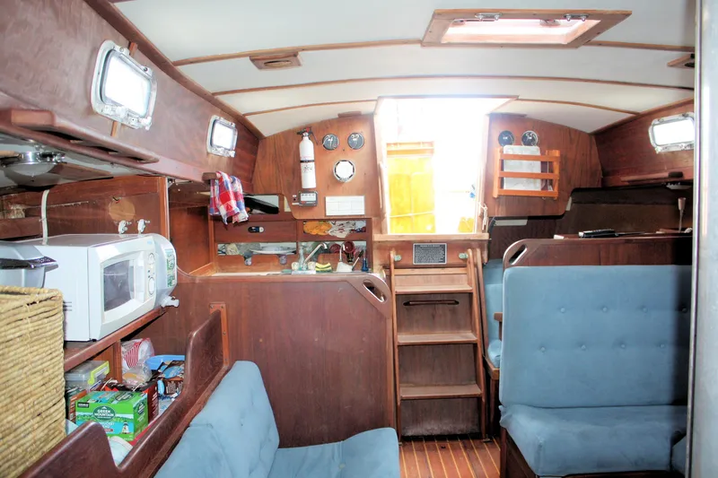 Slide: The Image of Interior of a 1978 Tartan 37 sailboat with wooden furnishings and seating. - 30