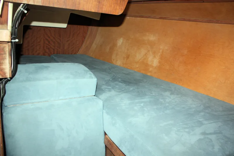 Slide: The Image of Interior cabin of a 1978 Tartan 37 sailboat with blue cushions. - 42