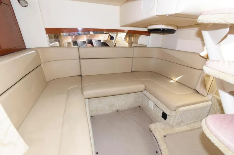 Slide: The Image of Interior of 2006 Sea Ray 320 Sundancer with beige seating and modern design. - 15