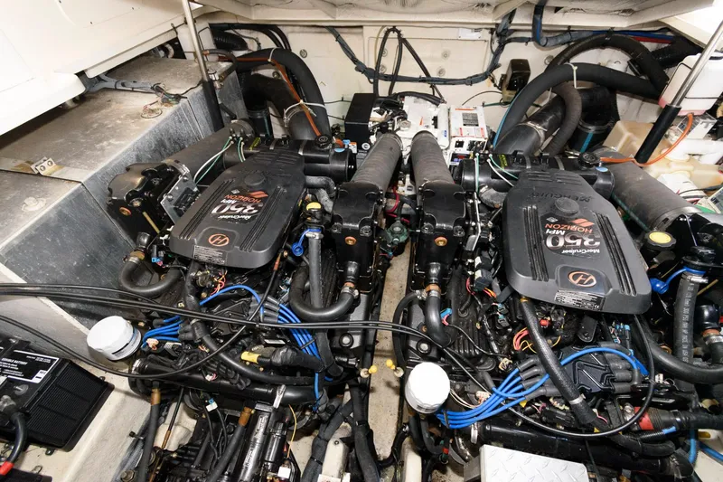 Slide: The Image of Engine room of 2006 Sea Ray 320 Sundancer with twin MerCruiser engines. - 18