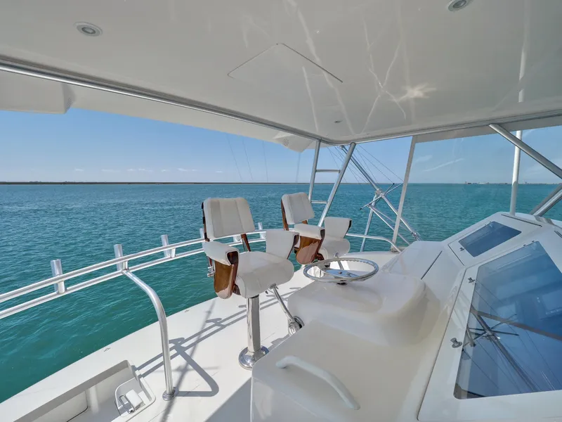 Slide: The Image of 2007 Viking Convertible yacht helm with ocean view and seating. - 10