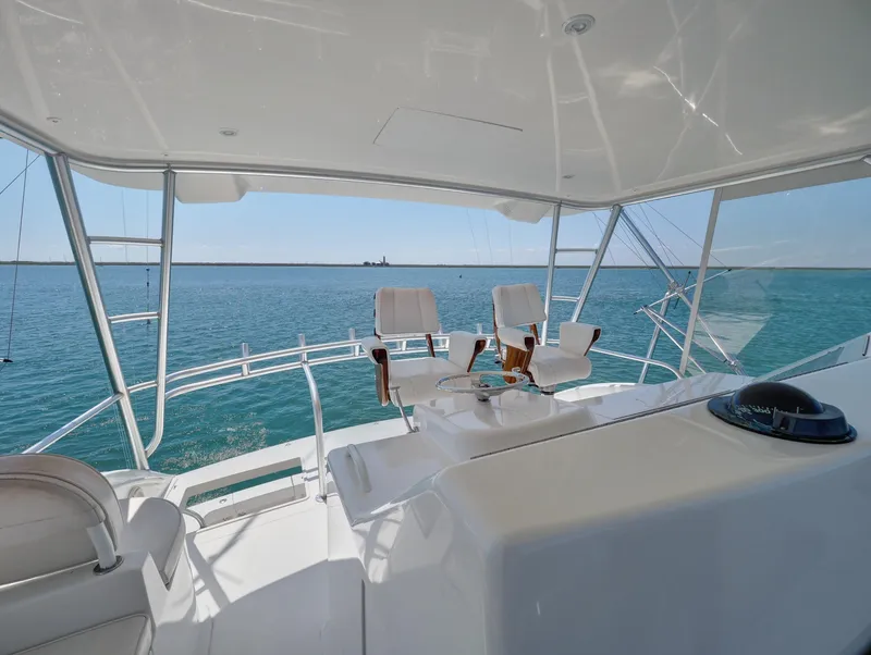 Slide: The Image of 2007 Viking Convertible yacht mezzanine with ocean view and seating. - 11