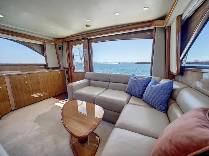 Slide: The Image of Luxurious 2007 Viking Convertible yacht interior with ocean view, featuring plush seating and elegant decor. - 21