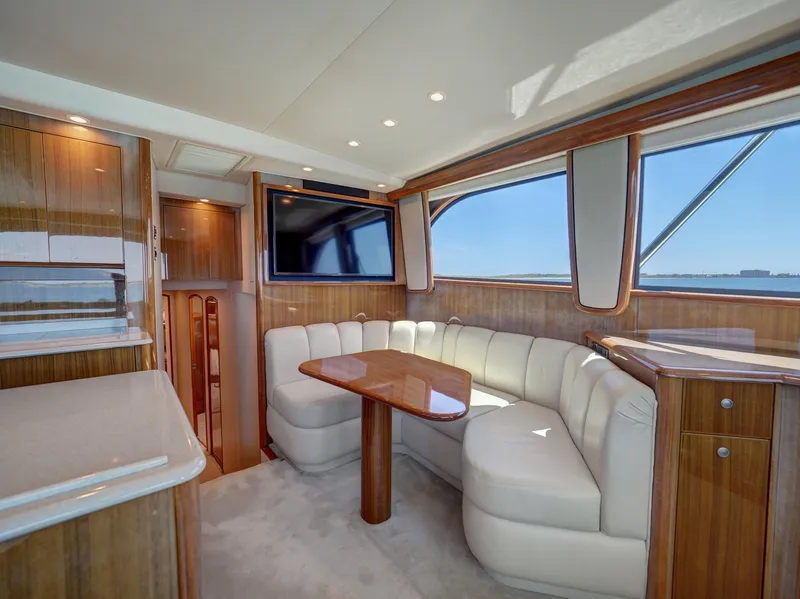 Slide: The Image of Luxurious 2007 Viking Convertible yacht interior with plush seating and elegant wood finishes. - 22