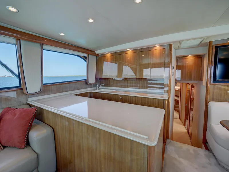 Slide: The Image of Luxurious 2007 Viking Convertible yacht interior with mezzanine, featuring elegant wood finishes and ocean views. - 23