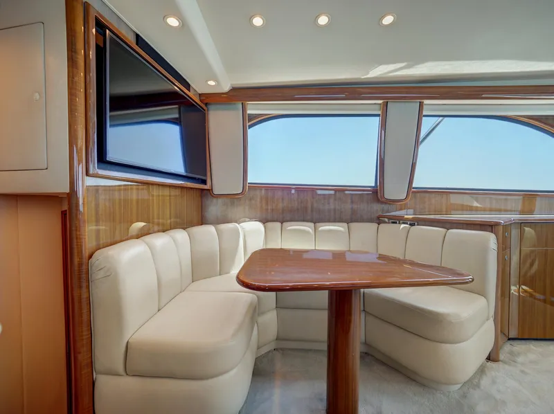 Slide: The Image of Luxurious 2007 Viking Convertible yacht interior with plush seating and elegant wood finishes. - 24