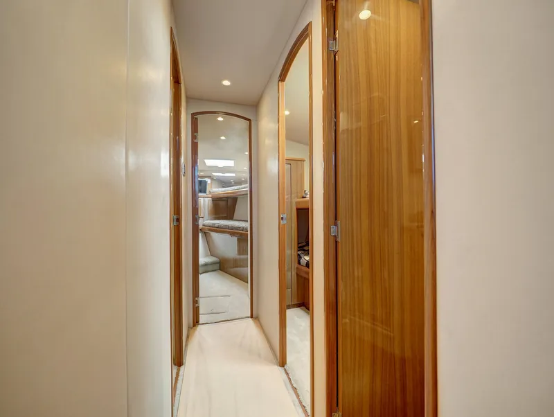 Slide: The Image of Interior hallway of 2007 Viking Convertible yacht with wooden doors and modern design. - 28