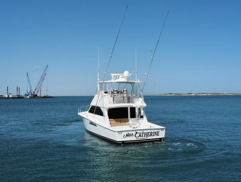 Slide: The Image of 2007 Viking Convertible yacht with mezzanine cruising in open water. - 3