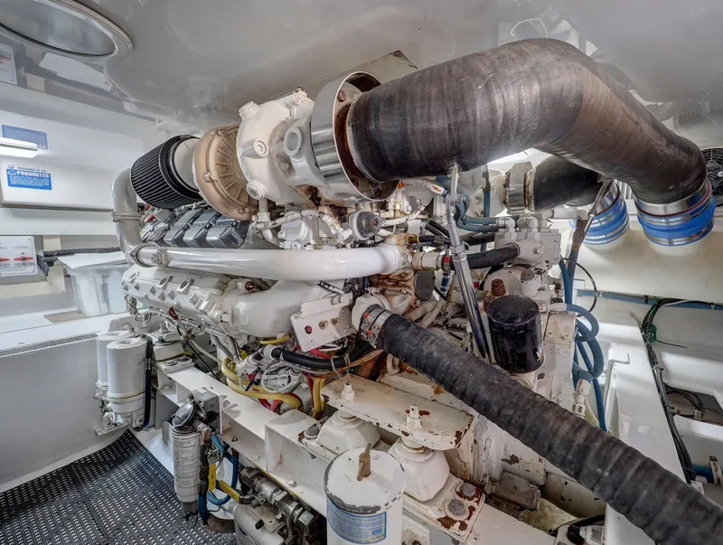 Slide: The Image of Engine room of 2007 Viking Convertible yacht, showcasing complex machinery and components. - 38