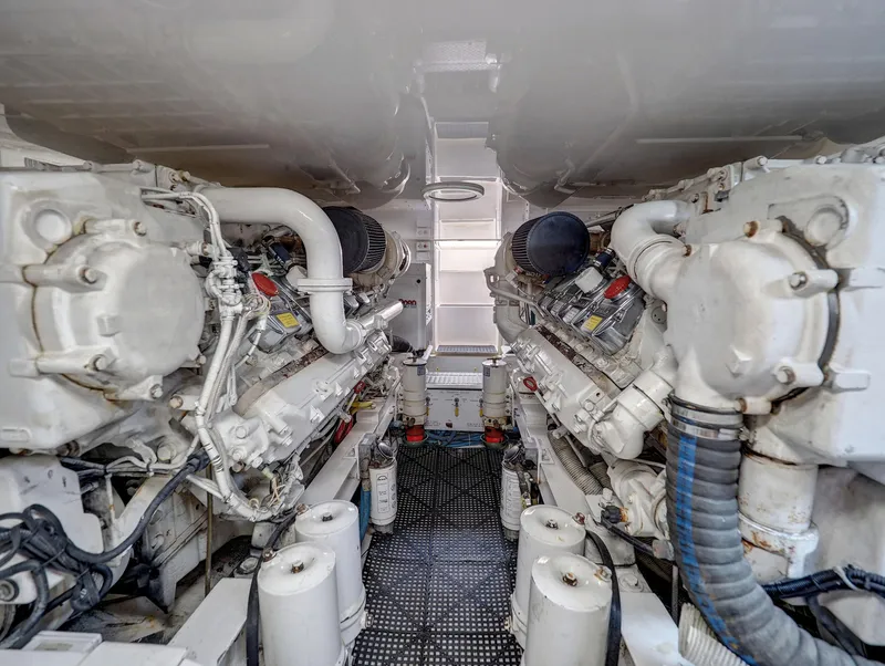 Slide: The Image of Engine room of 2007 Viking Convertible yacht, showcasing dual engines and mechanical components. - 39