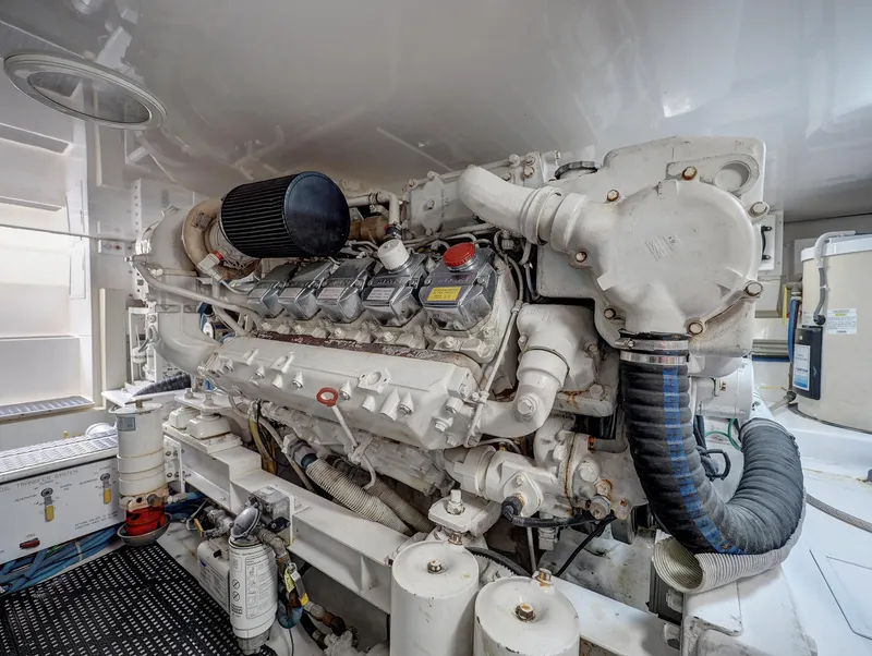 Slide: The Image of Engine room of 2007 Viking Convertible w/ Mezzanine, showcasing powerful marine engine components. - 40