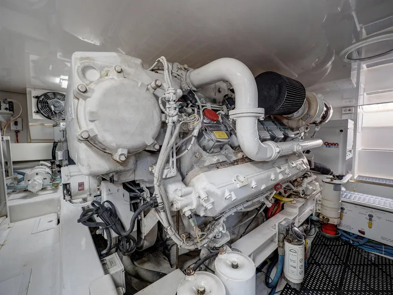 Slide: The Image of Engine room of 2007 Viking Convertible w/ Mezzanine yacht, showcasing detailed machinery. - 41