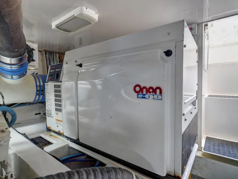 Slide: The Image of Onan generator in 2007 Viking Convertible yacht engine room. - 42