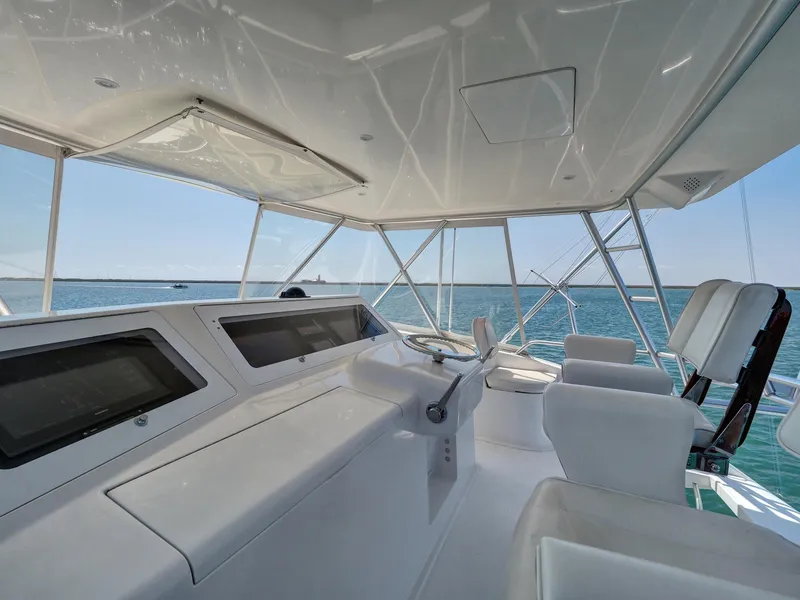 Slide: The Image of 2007 Viking Convertible yacht helm with ocean view and modern controls. - 7