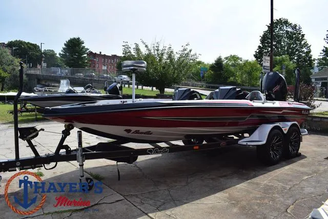 Slide: The Image of 2025 Bass Cat Puma STS boat on trailer at Thayer's Marine dealership. - 11