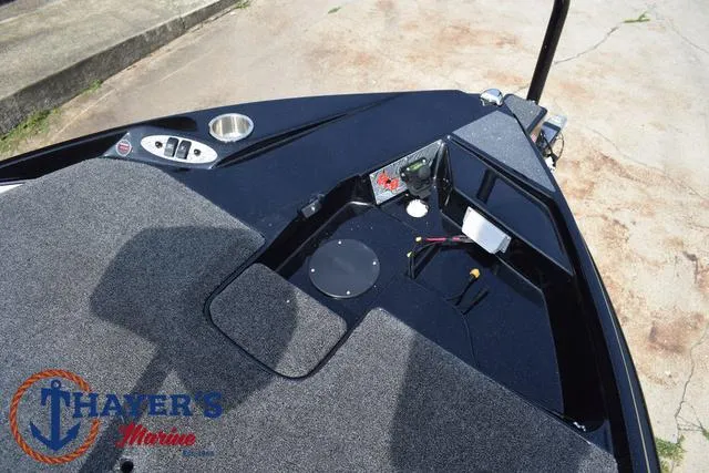 Slide: The Image of 2025 Bass Cat Puma STS boat deck with storage compartments and control panel. - 14