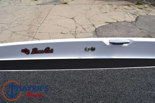 Slide: The Image of 2025 Bass Cat Puma STS boat deck with logo and textured surface. - 15