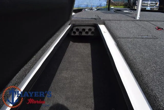 Slide: The Image of 2025 Bass Cat Puma STS boat storage compartment with Thayer's Marine logo. - 18