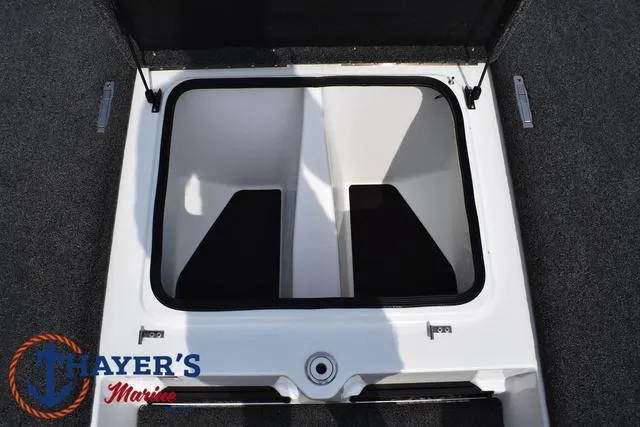 Slide: The Image of 2025 Bass Cat Puma STS storage compartment, open lid, Thayer's Marine logo visible. - 21