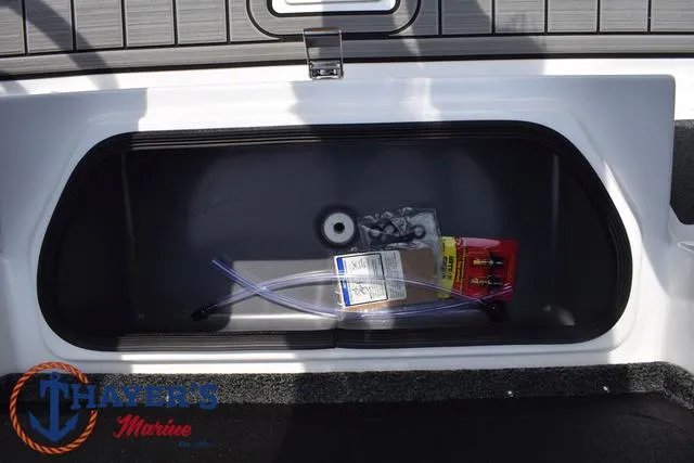 Slide: The Image of 2025 Bass Cat Puma STS storage compartment with accessories inside. - 23