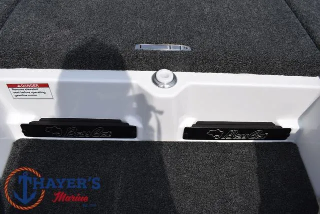 Slide: The Image of 2025 Bass Cat Puma STS boat deck with Thayer's Marine logo. - 24
