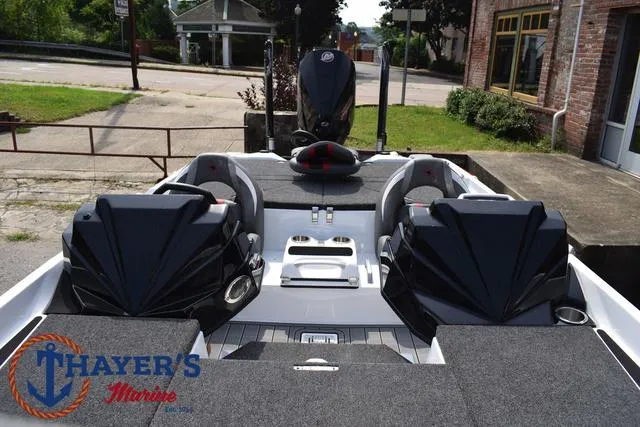 Slide: The Image of 2025 Bass Cat Puma STS boat interior with seating and storage, displayed at Thayer's Marine. - 25