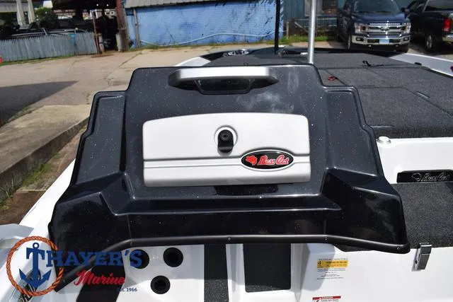 Slide: The Image of 2025 Bass Cat Puma STS boat deck with storage compartment and Thayer's Marine logo. - 29