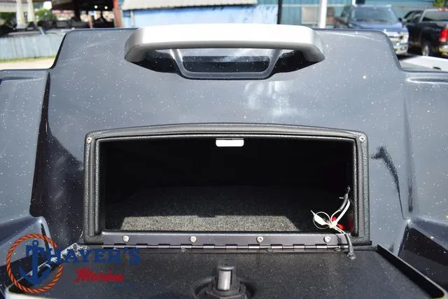 Slide: The Image of 2025 Bass Cat Puma STS storage compartment with open lid, showing interior space. - 30