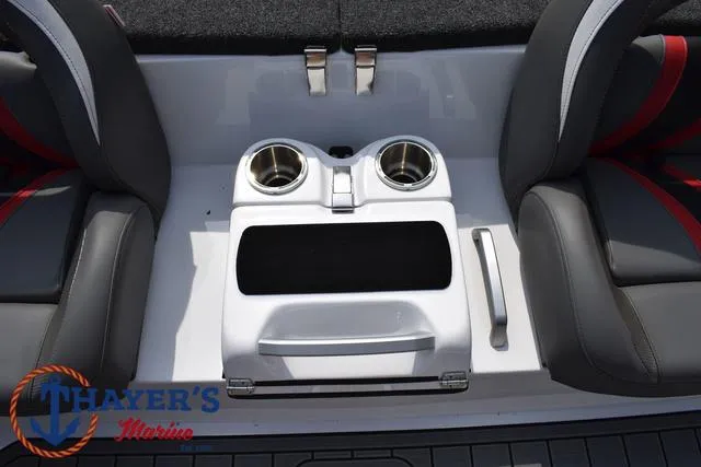 Slide: The Image of 2025 Bass Cat Puma STS boat interior with cup holders and storage compartment. - 31