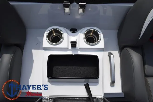 Slide: The Image of 2025 Bass Cat Puma STS boat console with cup holders and storage compartment. - 32