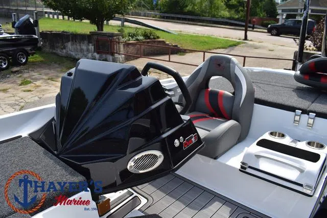 Slide: The Image of 2025 Bass Cat Puma STS boat interior with steering wheel and seating. - 34