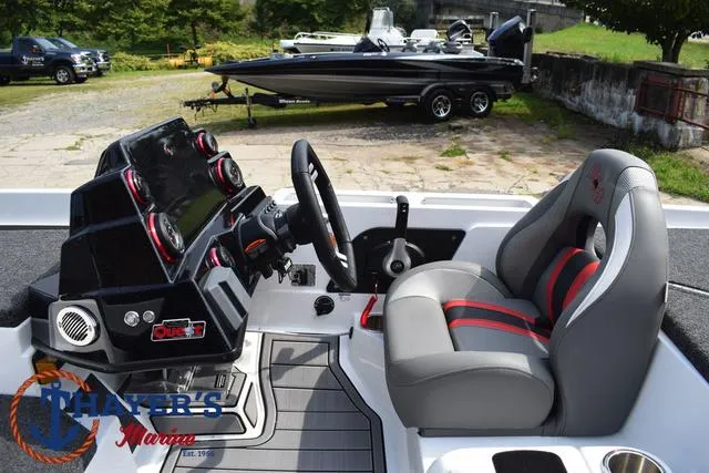 Slide: The Image of 2025 Bass Cat Puma STS boat interior with modern dashboard and comfortable seating. - 35
