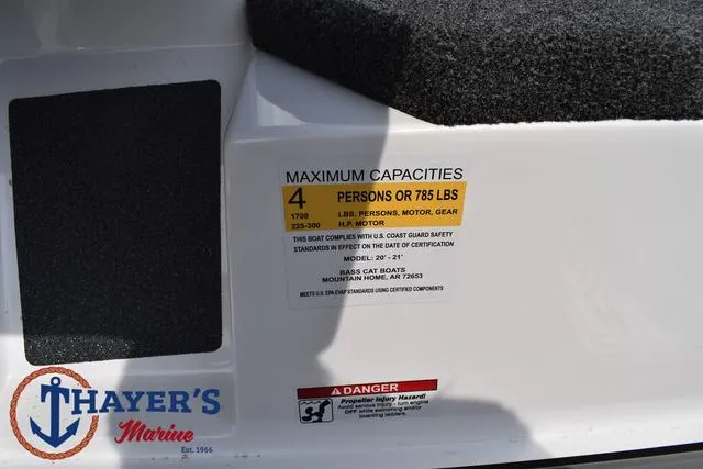 Slide: The Image of Bass Cat Puma STS 2025 capacity label, maximum 4 persons or 785 lbs, Thayer's Marine logo. - 38