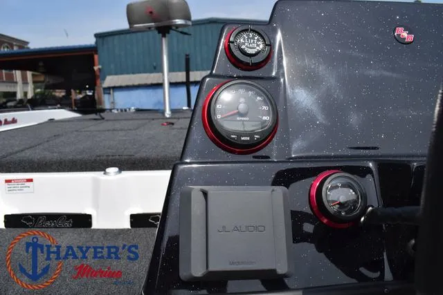 Slide: The Image of 2025 Bass Cat Puma STS dashboard with JL Audio system and gauges at Thayer's Marine. - 39