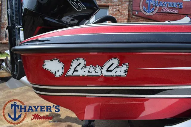 Slide: The Image of 2025 Bass Cat Puma STS boat with red and black design at Thayer's Marine. - 4